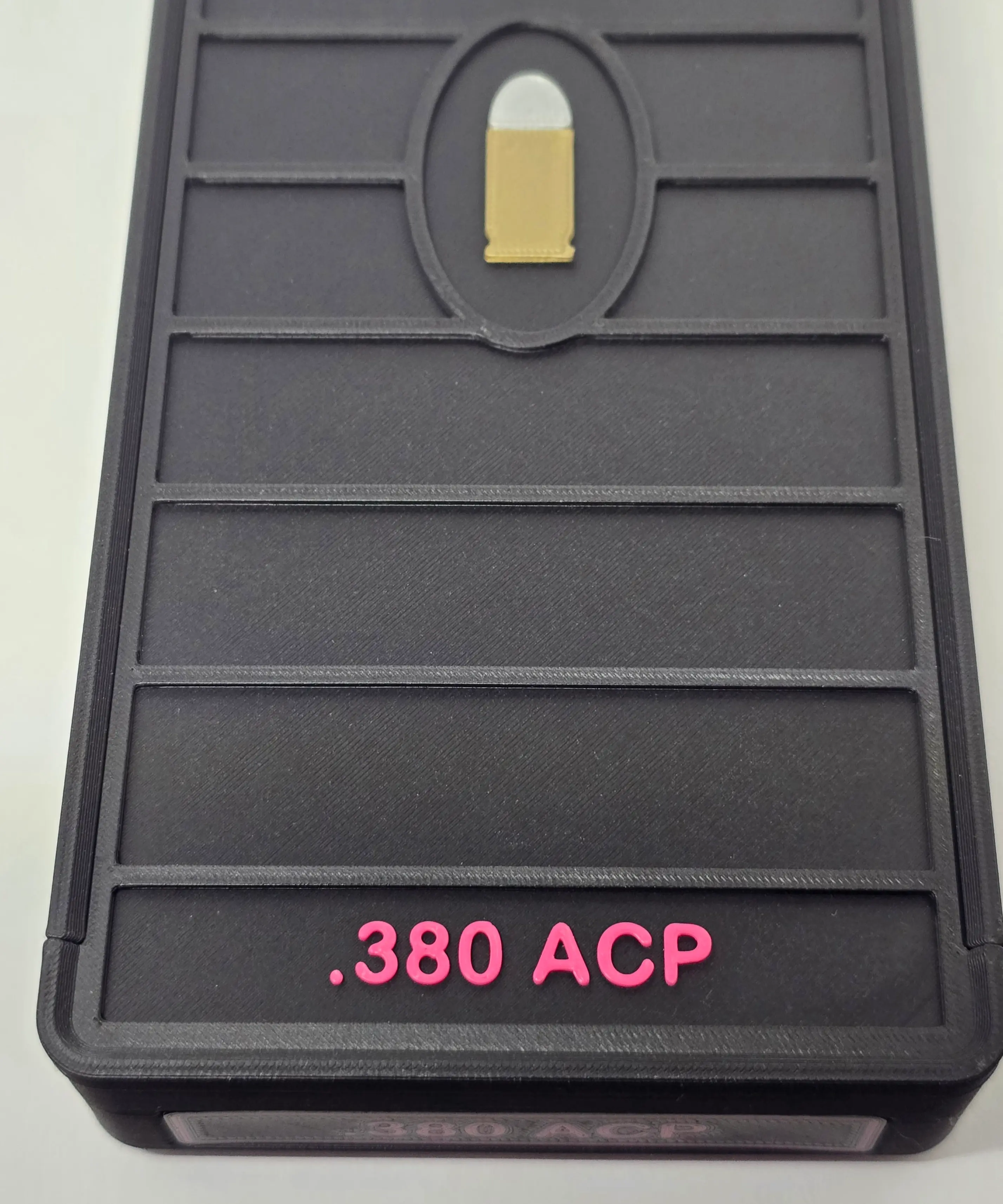 Top view of Black and Hot Pink .380 ACP ForgeBox lid