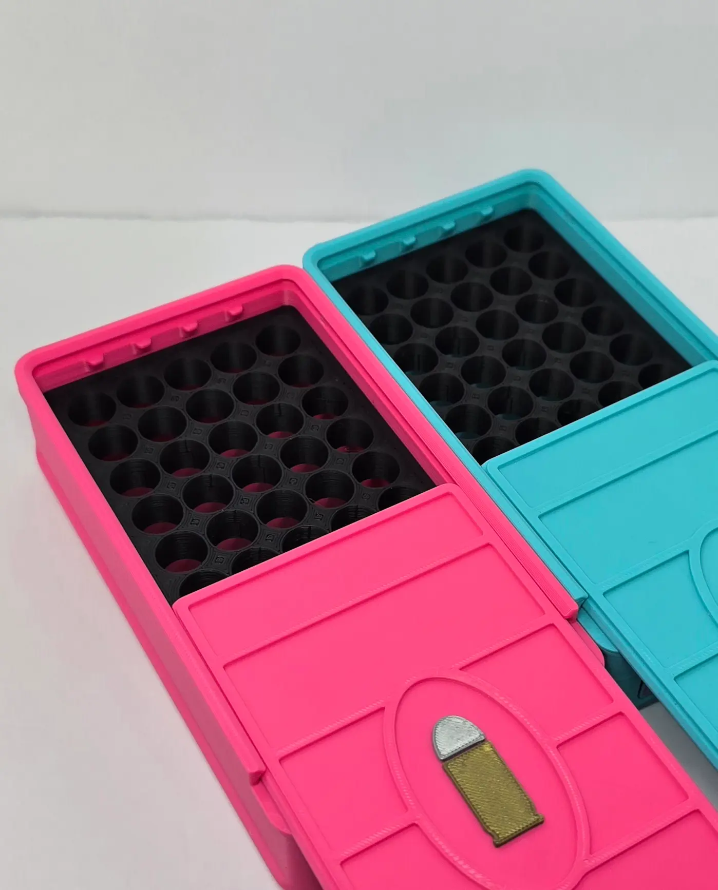 Open custom .380 ACP ammo boxes showing 50 round ammunition trays