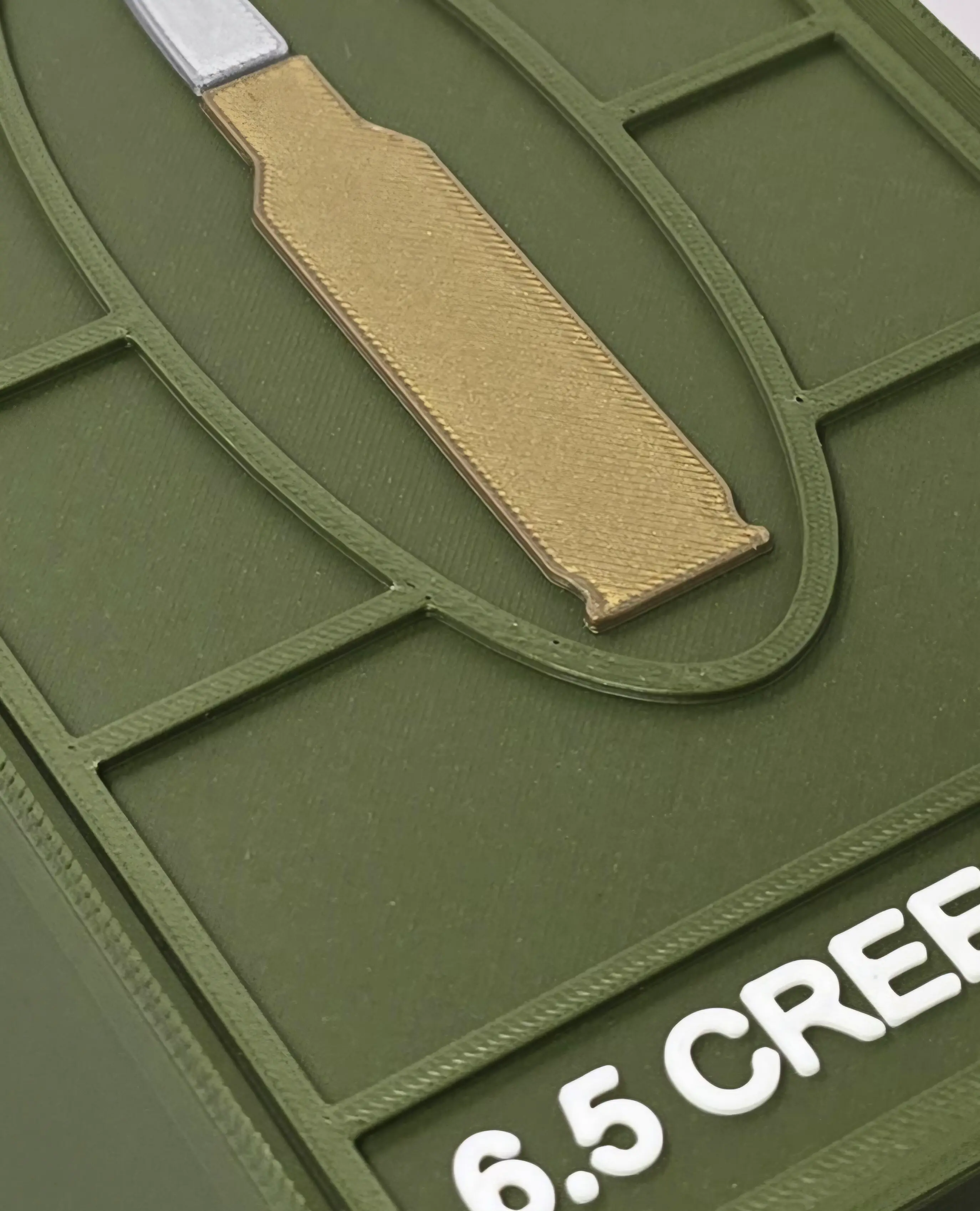 Close-up bullet detail on custom Dark Green 6.5 Creedmoor ForgeBox