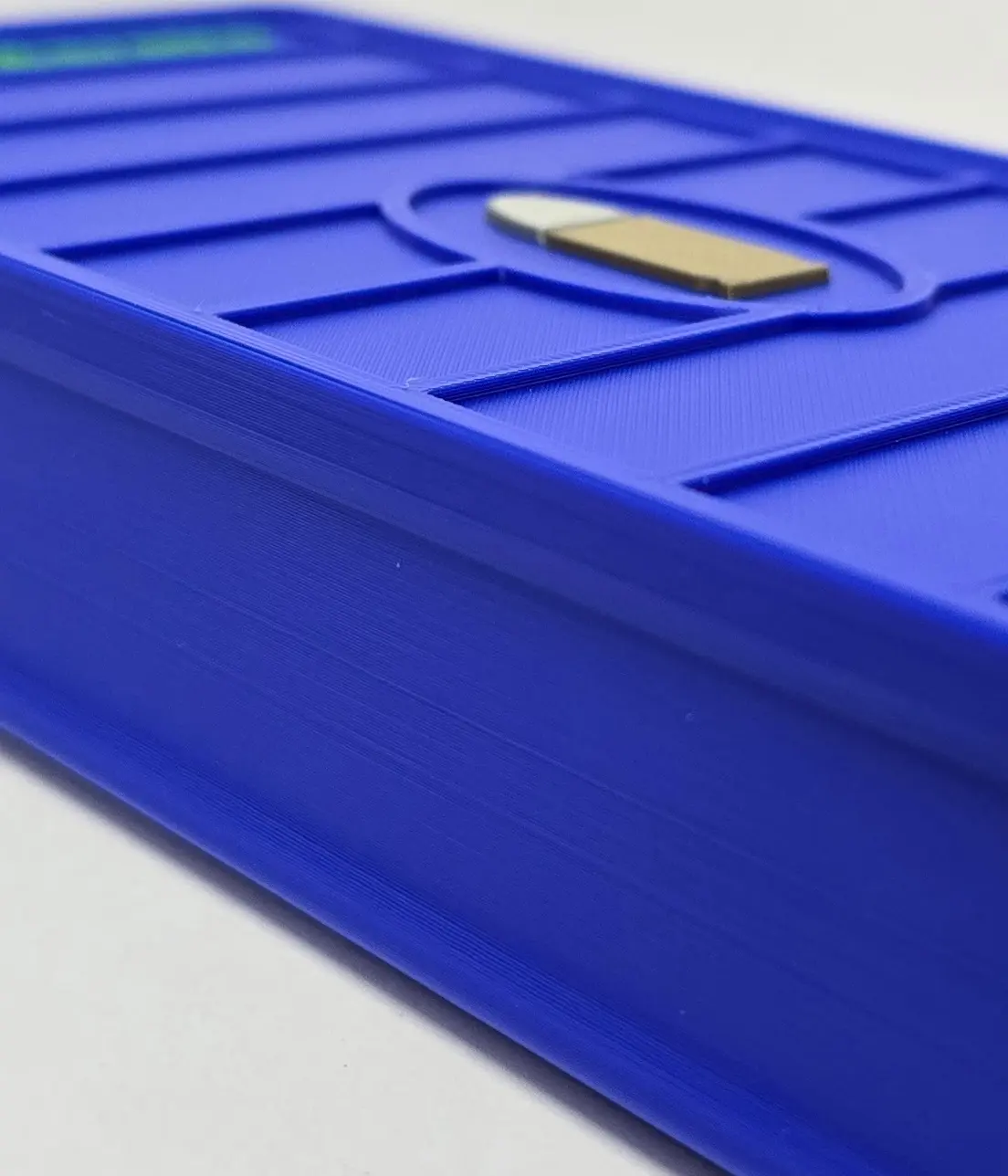 Side detail of Blue 9mm ForgeBox showing layer lines and finish