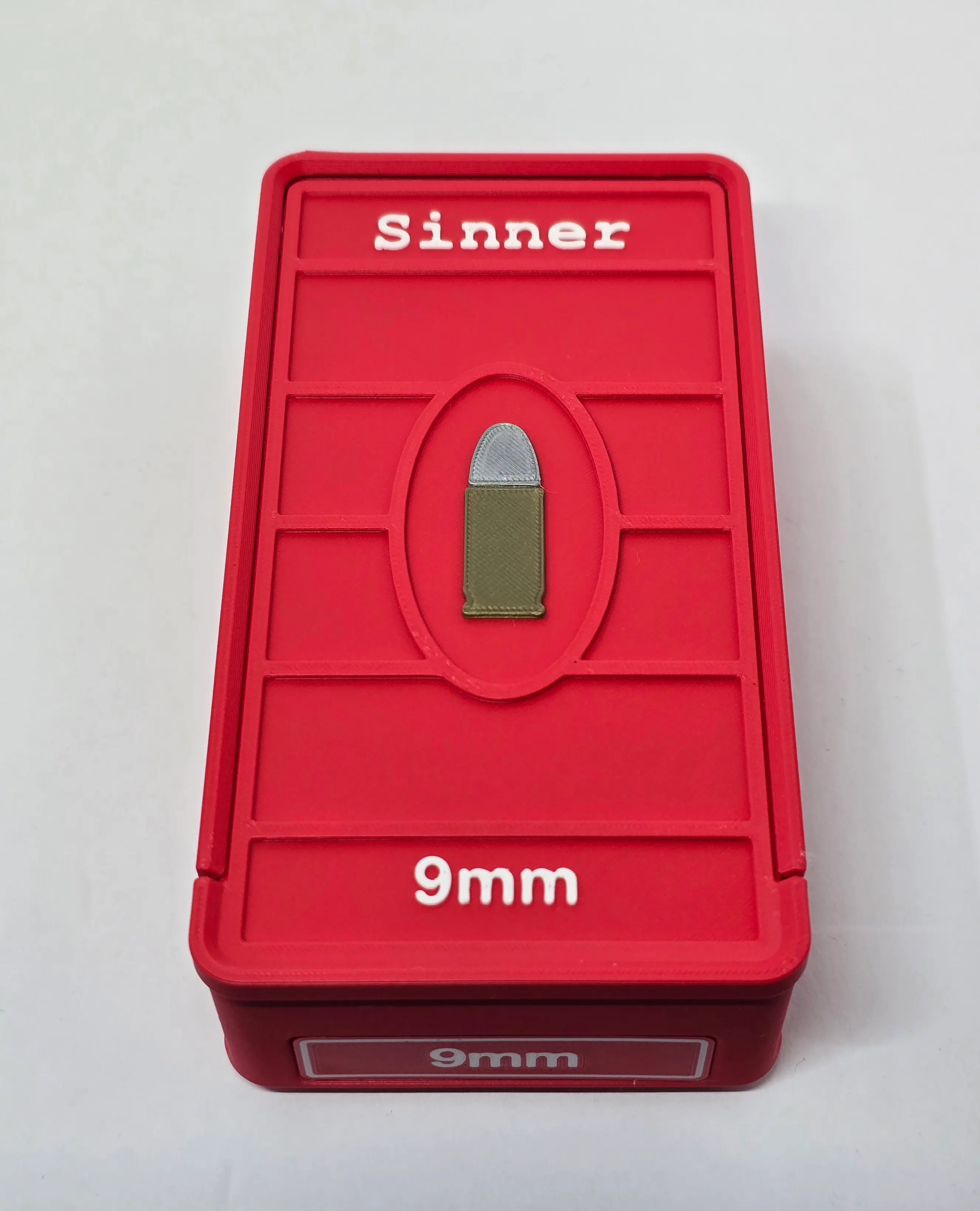 Top view of custom Sinner 9mm ForgeBox with Scarlet Red body and White text